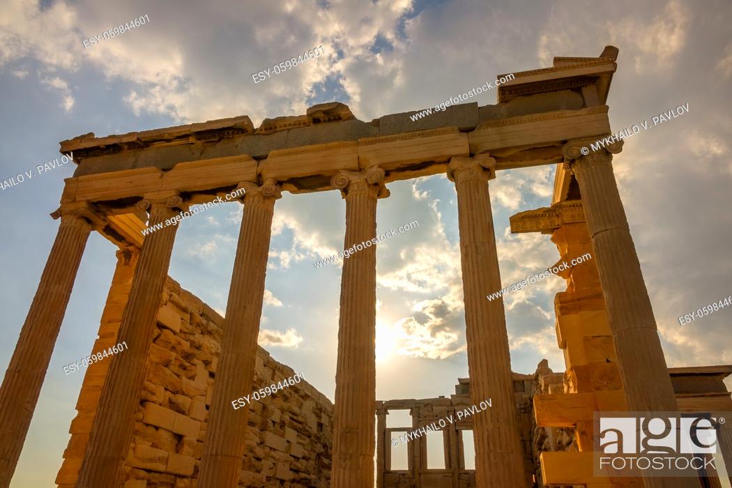 Stock Photo: Greece. Part of the facade of an ancient temple and the sunbeams in Athens.