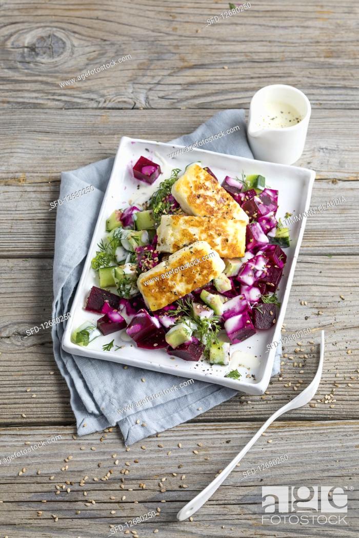 Stock Photo: Cucumber and beetroot salad with halloumi.