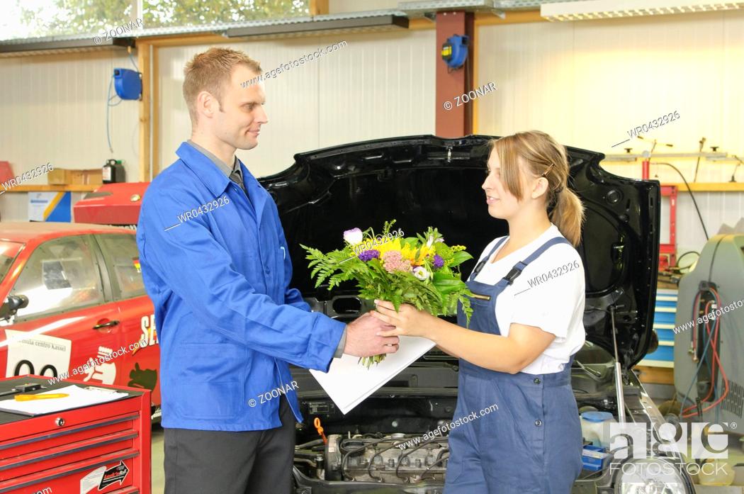 Stock Photo: Auto Repair, Master congratulates students.