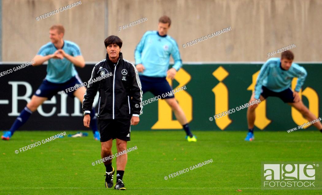 Stock Photo: Germany's head coach Joachim Loew (front) attends the training session of the German national soccer team in Duesseldorf, Germany, 08 October 2013.