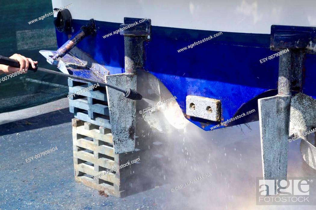 Stock Photo: blue boat hull cleaning pressure washer barnacles.