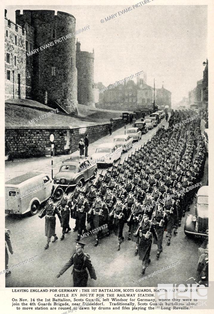 Stock Photo: Leaving England for Germany: the 1st battalion, Scots Guards, march past Windsor castle en route to the railway station.  On Nov.