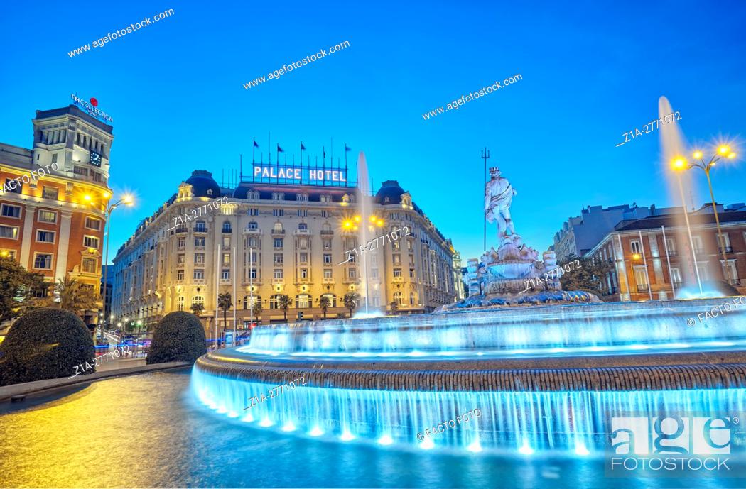 Stock Photo: Neptune fountain and the Palace hotel, located at the Paseo del Prado boulevard. Madrid, Spain.
