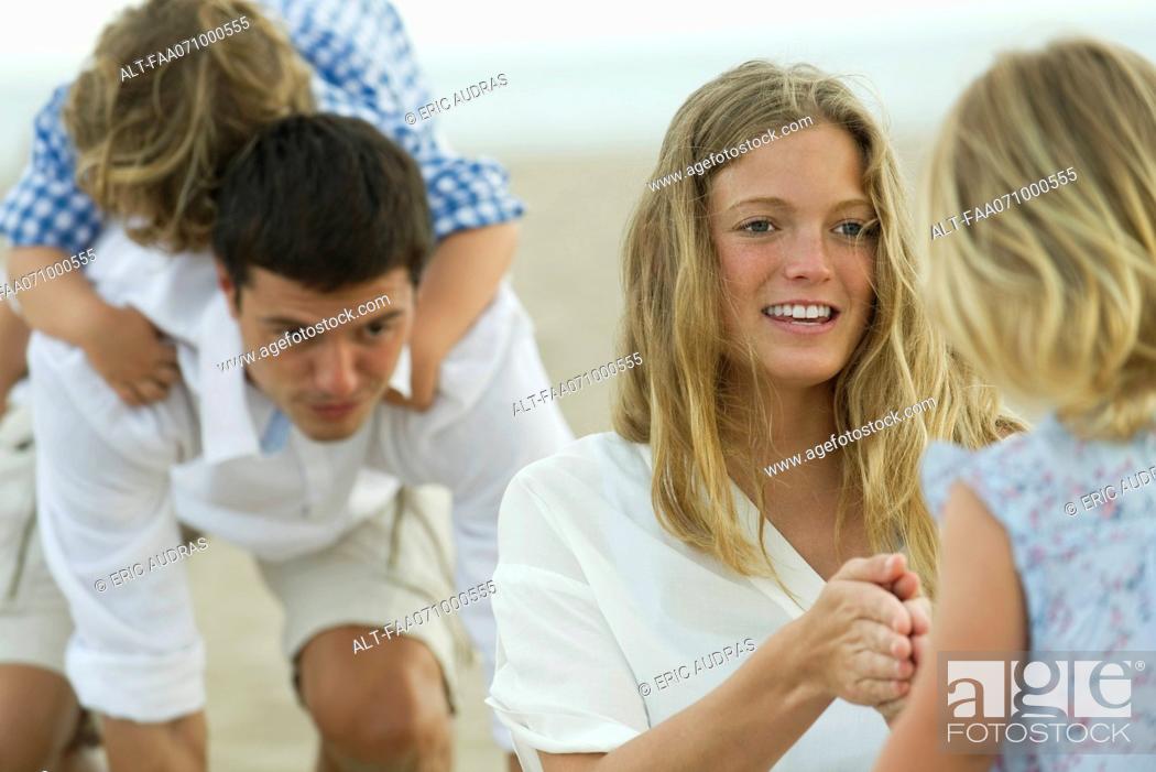 Stock Photo: Family playing at the beach.