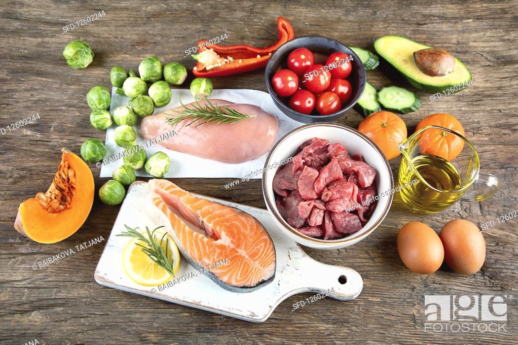 Stock Photo: Various Paleo diet products on wooden table.