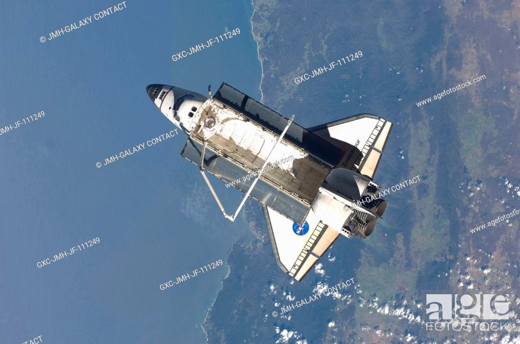 Stock Photo: The space shuttle Endeavour is featured in this image photographed by an Expedition 22 crew member on the International Space Station soon after the shuttle and.