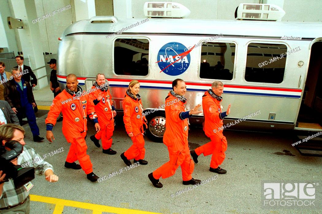 Stock Photo: The STS-98 crew leaves the Operations and Checkout Building and heads for the Astrovan that will take them to Space Shuttle Atlantis on Launch Pad 39A.