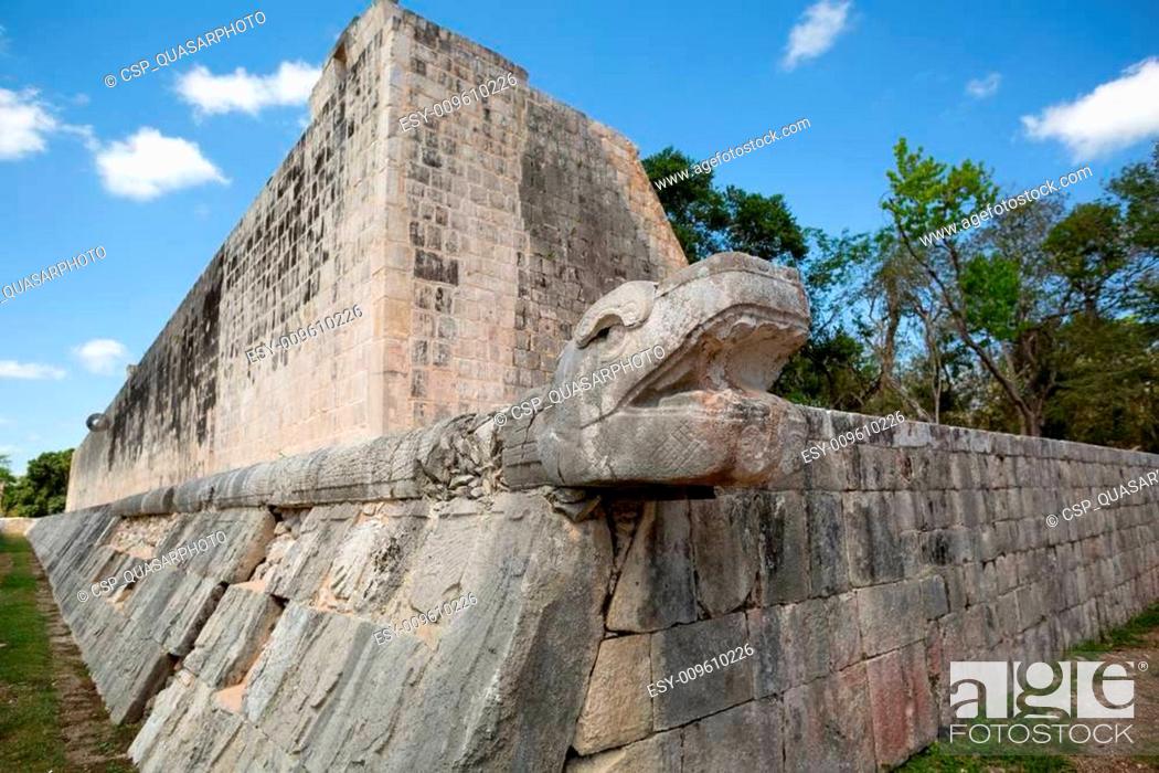Stock Photo: Mayan snake head sculpture on ball court.
