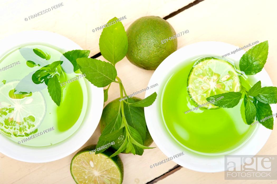 Stock Photo: fresh and healthy mint infusion tea tisane with lime.