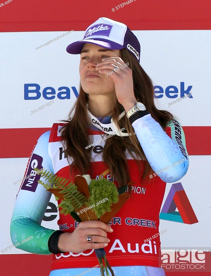 Stock Photo: Gold medalist Tina Maze of Slovenia celebrates during the flower ceremony after winning the Ladies' Downhill at the Alpine Skiing World Championships in Vail -.