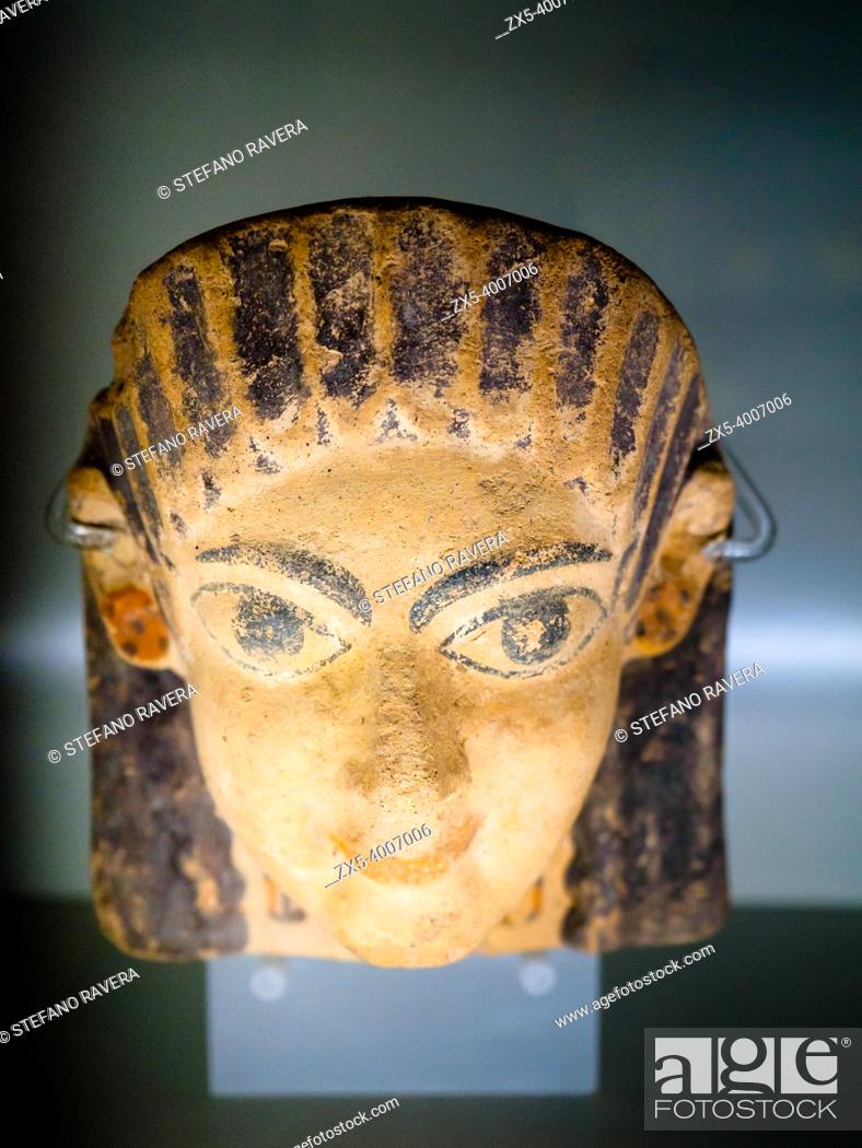 Stock Photo: Terracotta antefix in female head with big-headed face, flat and high wavy hair on the forehead 520-510 BC - National Etruscan Museum of Villa Giulia - Rome.