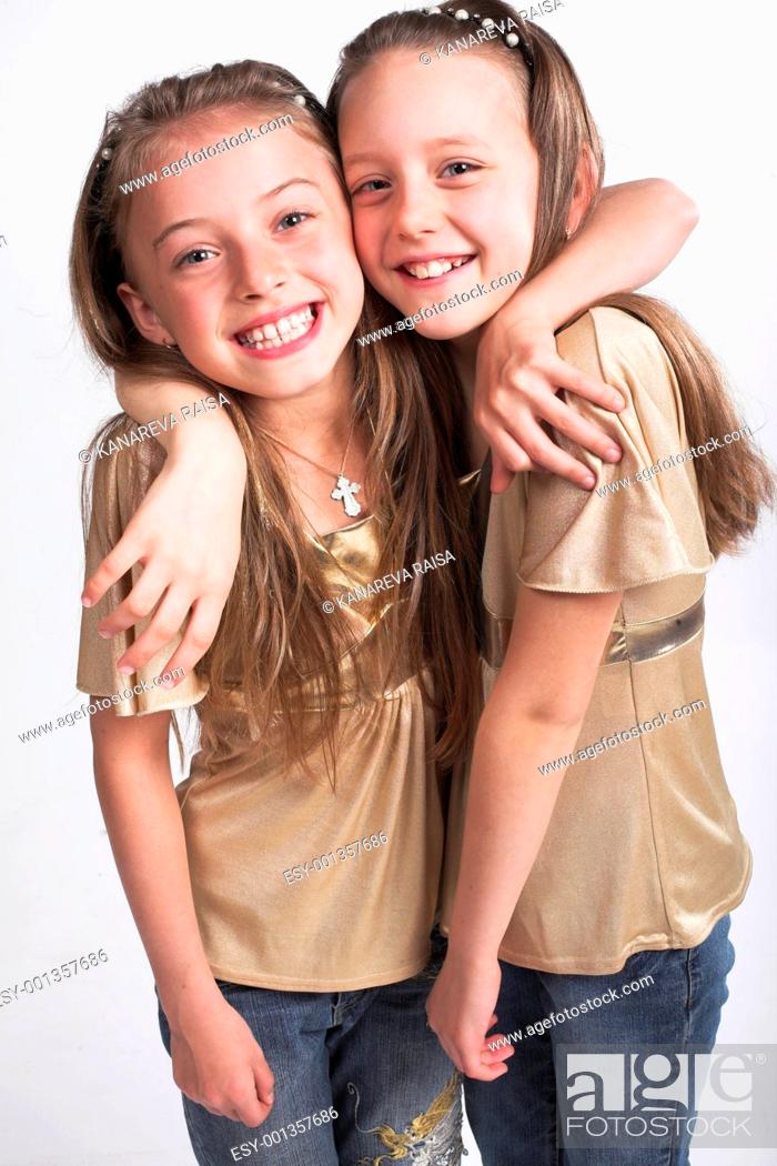 Stock Photo: Two little girls hugging each other.