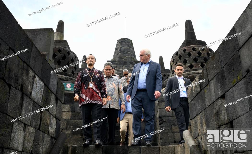 Stock Photo: 17 June 2022, Indonesia, Yogyakarta: German President Frank-Walter Steinmeier is guided through the Borobudur temple complex by Nahar Cahyan Daru (l).