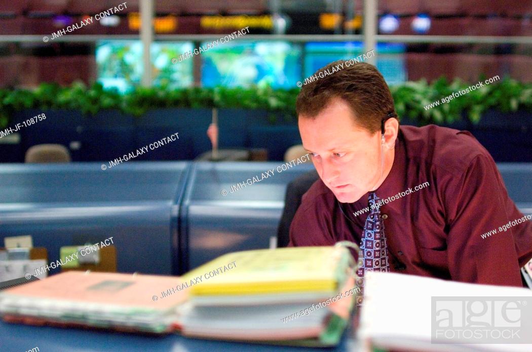 Stock Photo: In the space shuttle flight operations control room of Houston's Mission Control Center, Matt Abbott, lead STS-118 flight director.