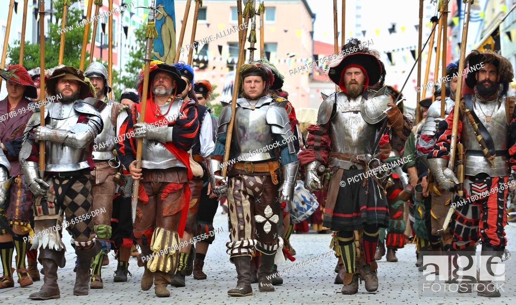 Stock Photo: 8 July 2018, Mindelheim, Germany: Participants of the Frundsberg Festival parade through the city centre of Mindelheim in historical costumes.