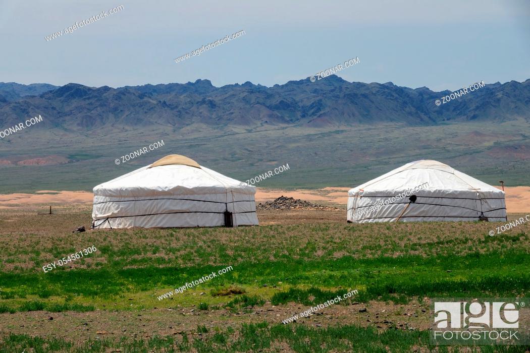 Stock Photo: Traditional yurts between montains in Mongolia.