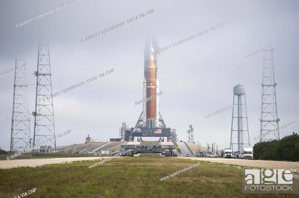 Stock Photo: NASA’s Space Launch System (SLS) rocket with the Orion spacecraft aboard is seen atop a mobile launcher at Launch Complex 39B, Friday, March 18, 2022.