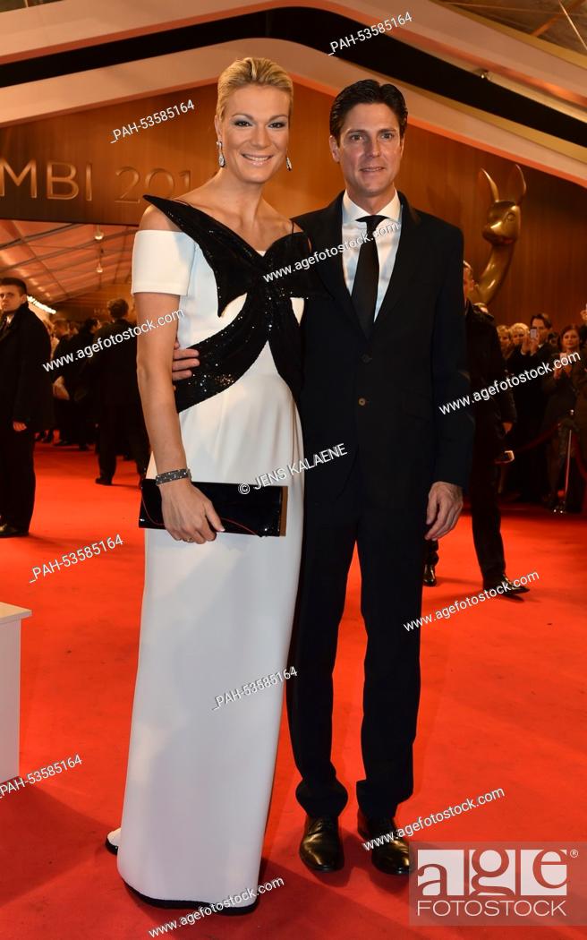 Stock Photo: Former skiier Maria Hoefl-Riesch and her husband Marcus Hoefl arrive on the red carpet area at the Stage Theater before the Bambi Awards at Potsdamer Platz.
