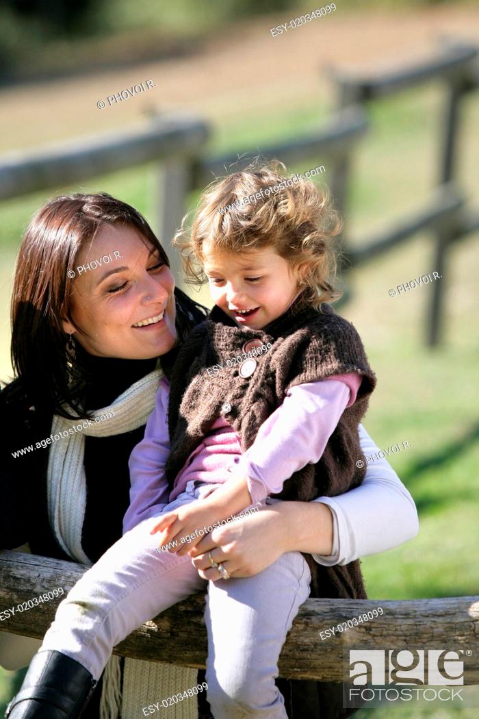 Stock Photo: Mother spending quality time with her daughter in the countryside.