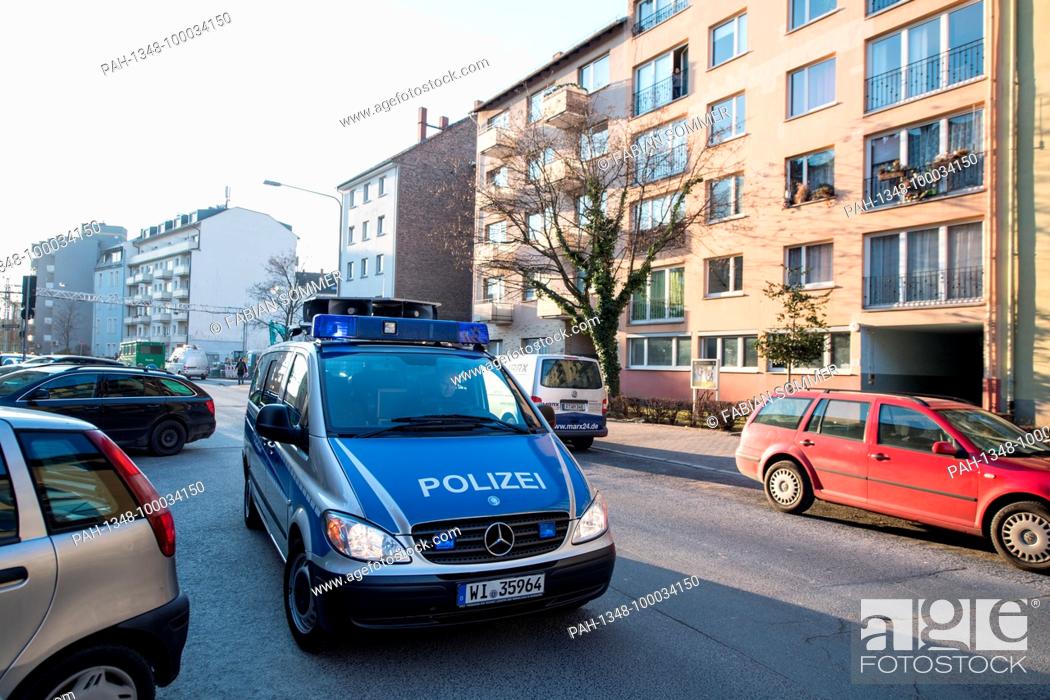 Stock Photo: A police car uses loudspeakers to announce the imminent evacuation of the residents in the surrounding area. Blast masters of the Hessian Explosive ordnance.