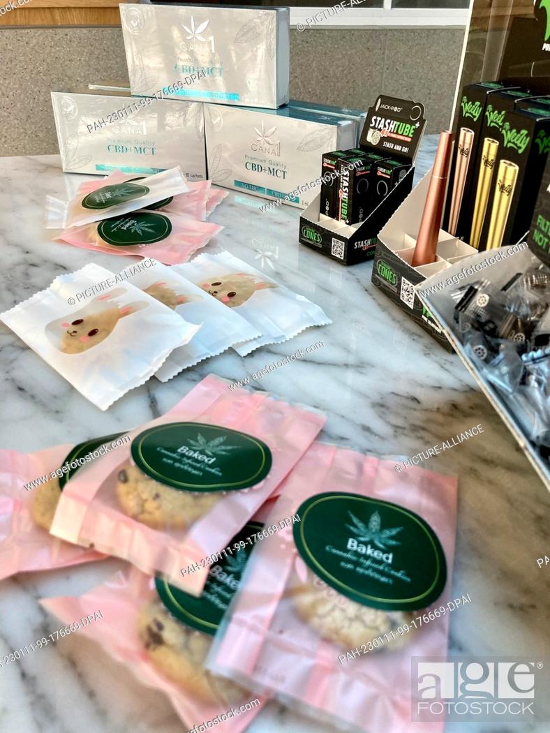 Stock Photo: PRODUCTION - 08 January 2023, Thailand, Bangkok: Cannabis cookies, medical cannabis and other cannabis products, taken in the store ""Cannabis Kingdom"" in the.