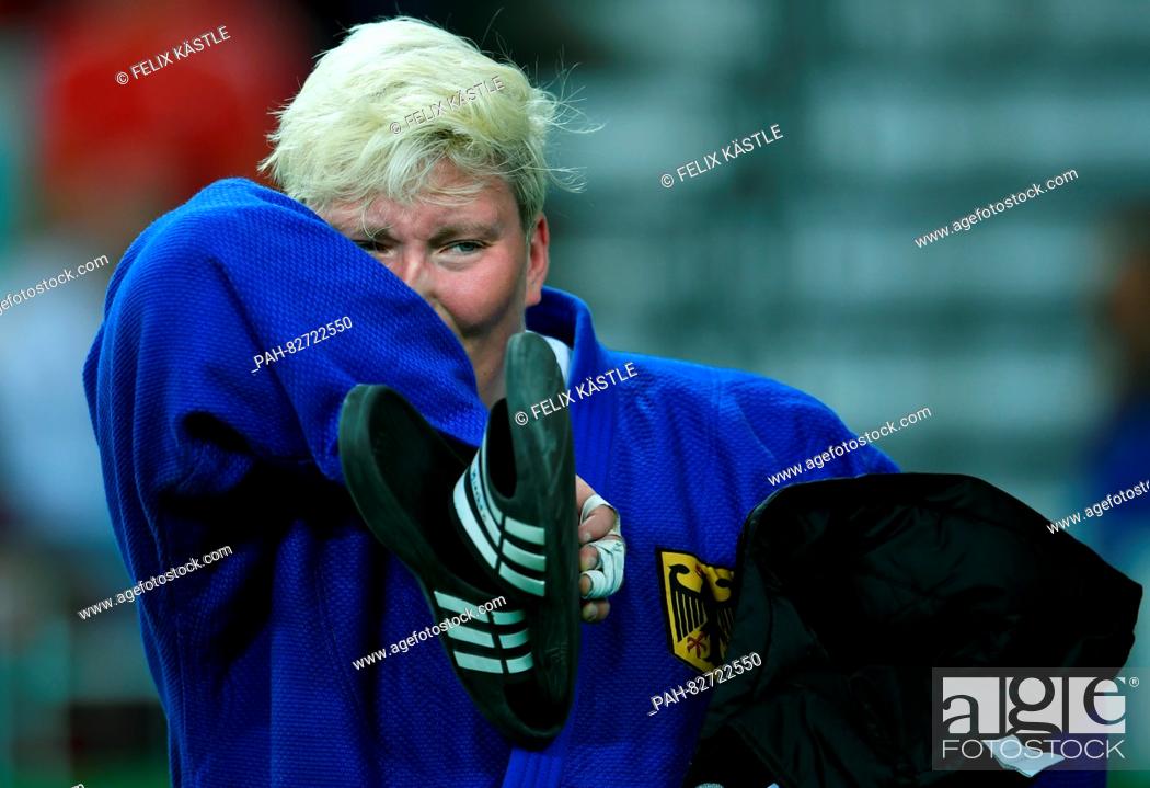 Stock Photo: Jasmin Kuelbs of Germany (blue) reacts after loosing against Ksenia Chibisova of Russia (not pictured) during the Women +78 kg Elimination Round of 32 of the.