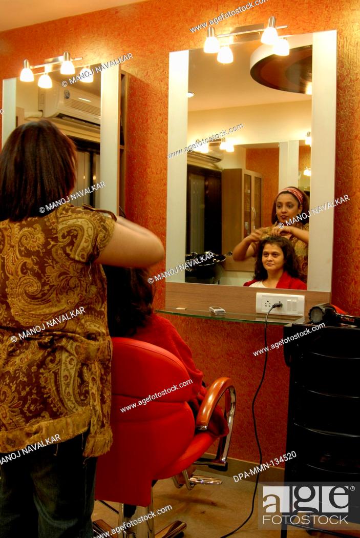 Hair styling and color highlighting treatment in beauty parlour at Vakola ;  Santacruz ; Mumbai..., Stock Photo, Picture And Rights Managed Image. Pic.  DPA-MMN-134520 | agefotostock