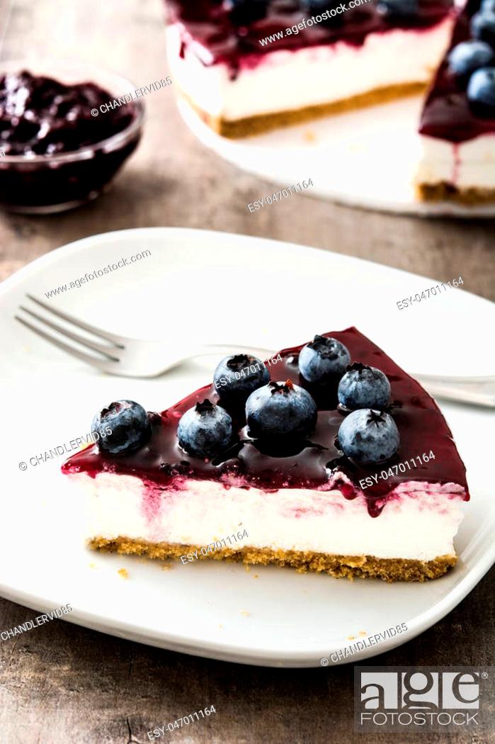 Stock Photo: Piece of blueberry cheesecake on gray stone.
