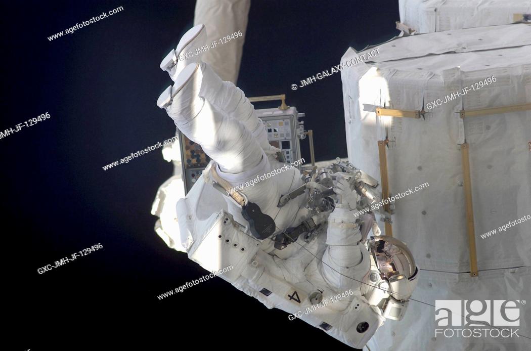 Stock Photo: Astronaut Daniel W. Bursch, Expedition Four flight engineer, participates in the five-hour, 47-minute space walk on February 20, 2002.