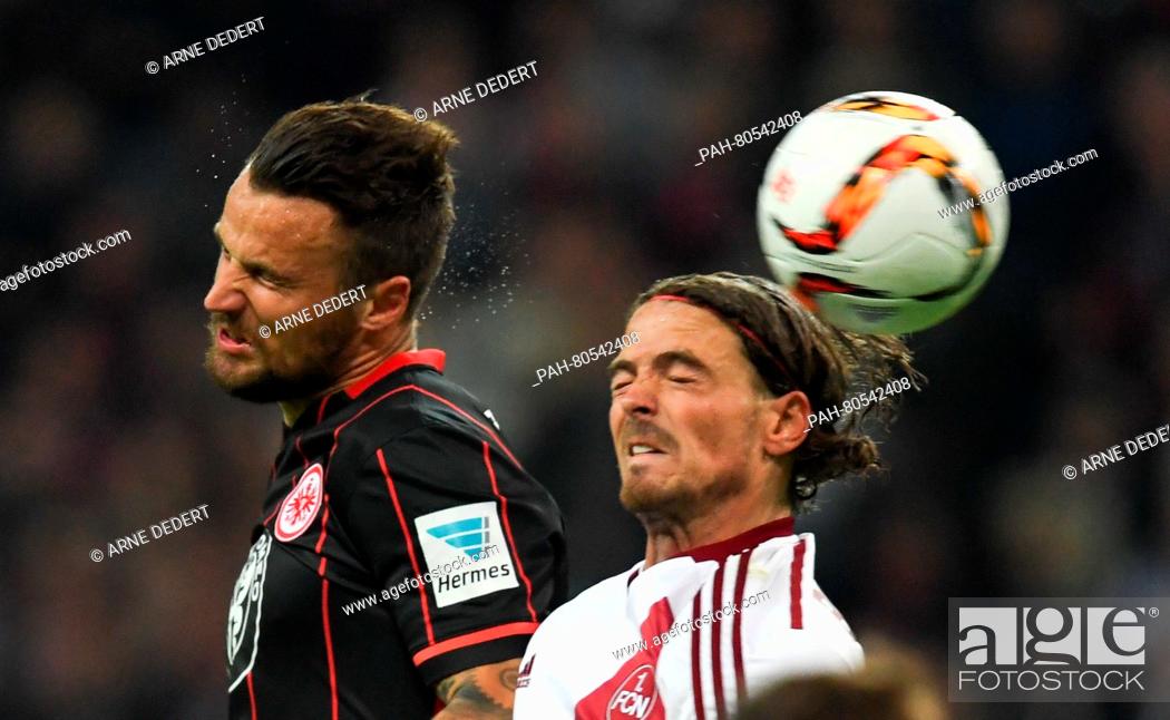Stock Photo: Frankfurt's Haris Seferovic (L) and Nuremberg's David Bulthuis vie for the ball during the German Bundesliga relegation match in Frankfurt/Main,  Germany.