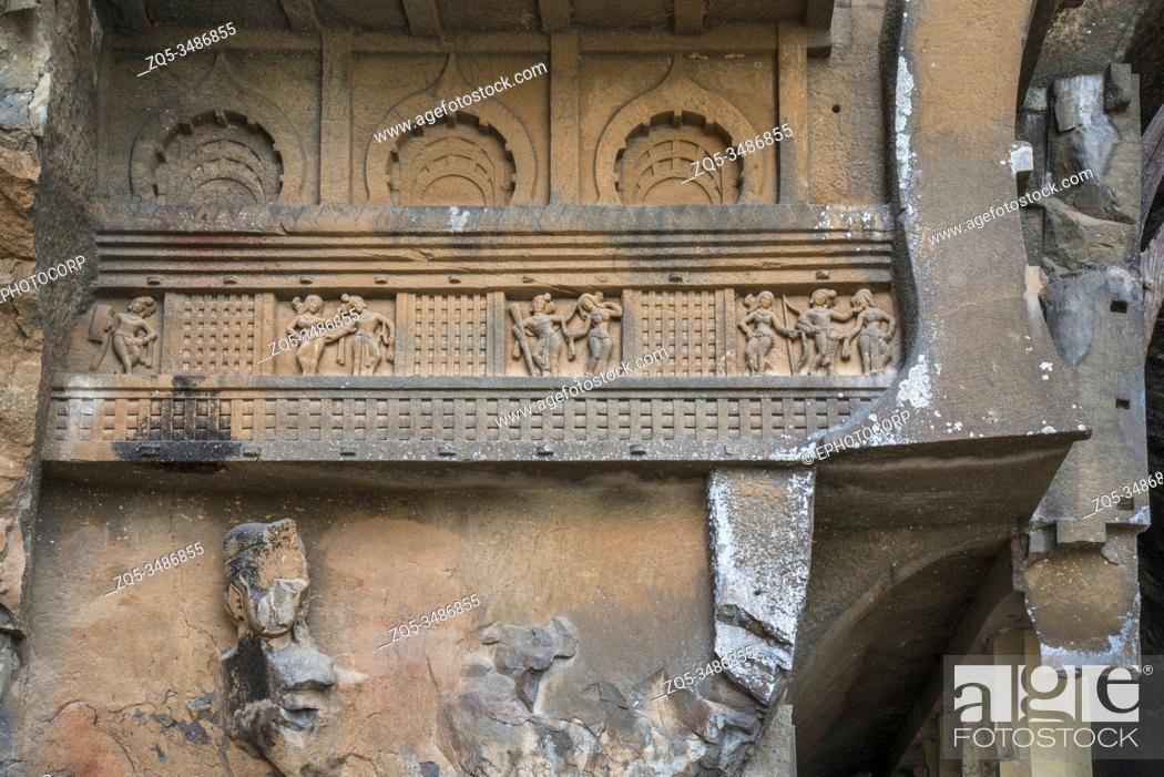 Stock Photo: Kondana Caves, Karjat, Maharashtra, India : Left side of façade showing dancing figures below which is the guardian Yaksha and miniature arches above.