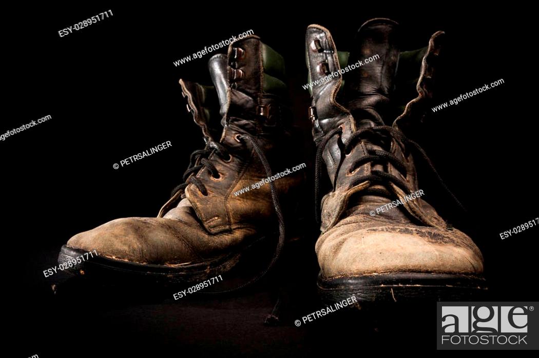 Glare master Explicitly old soldier's boots worn with scratches and untied shoelaces on black  background, Stock Photo, Picture And Low Budget Royalty Free Image. Pic.  ESY-028951711 | agefotostock