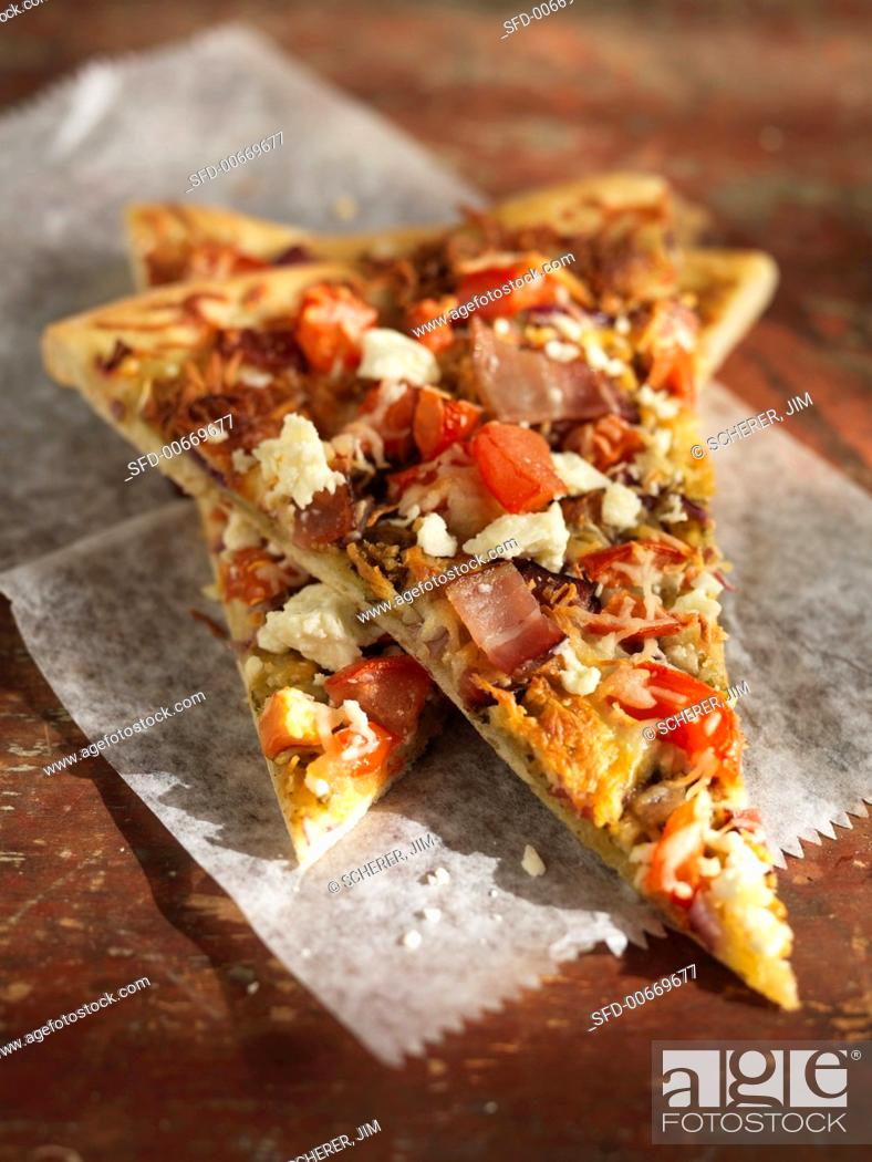 Stock Photo: Pizza Slices with Tomato, Feta, Ham and Red Onion.