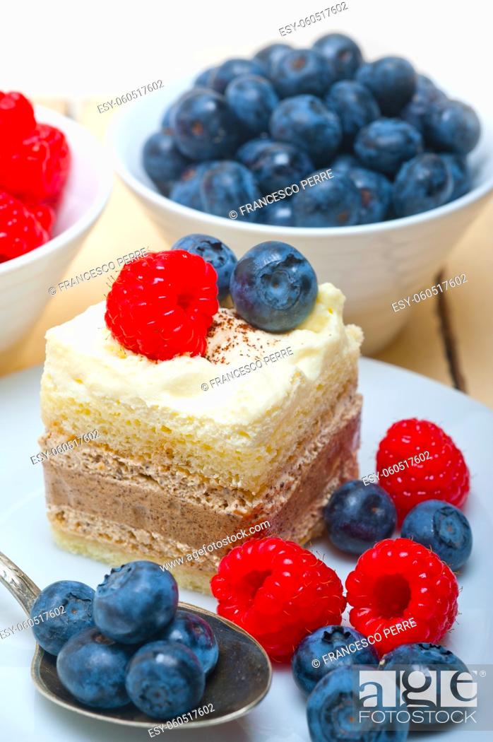Stock Photo: fresh homemade raspberry and blueberry cream cake.