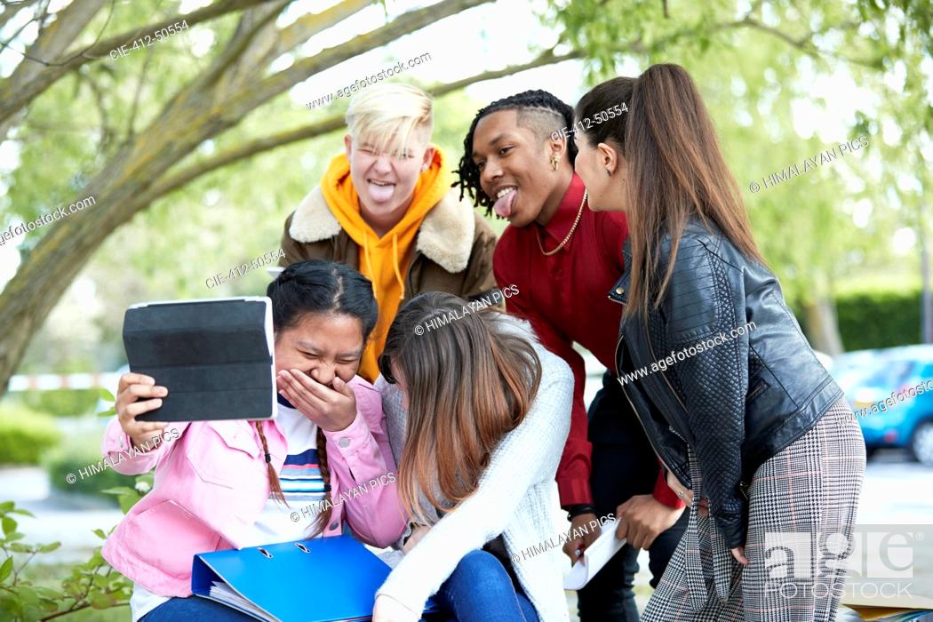 Stock Photo: Playful happy college student friends digital tablet selfie park.