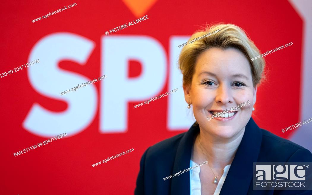 Stock Photo: 30 November 2021, Berlin: Franziska Giffey, leader of the Berlin SPD and designated governing mayor of Berlin, sits in front of a red heart with the inscription.