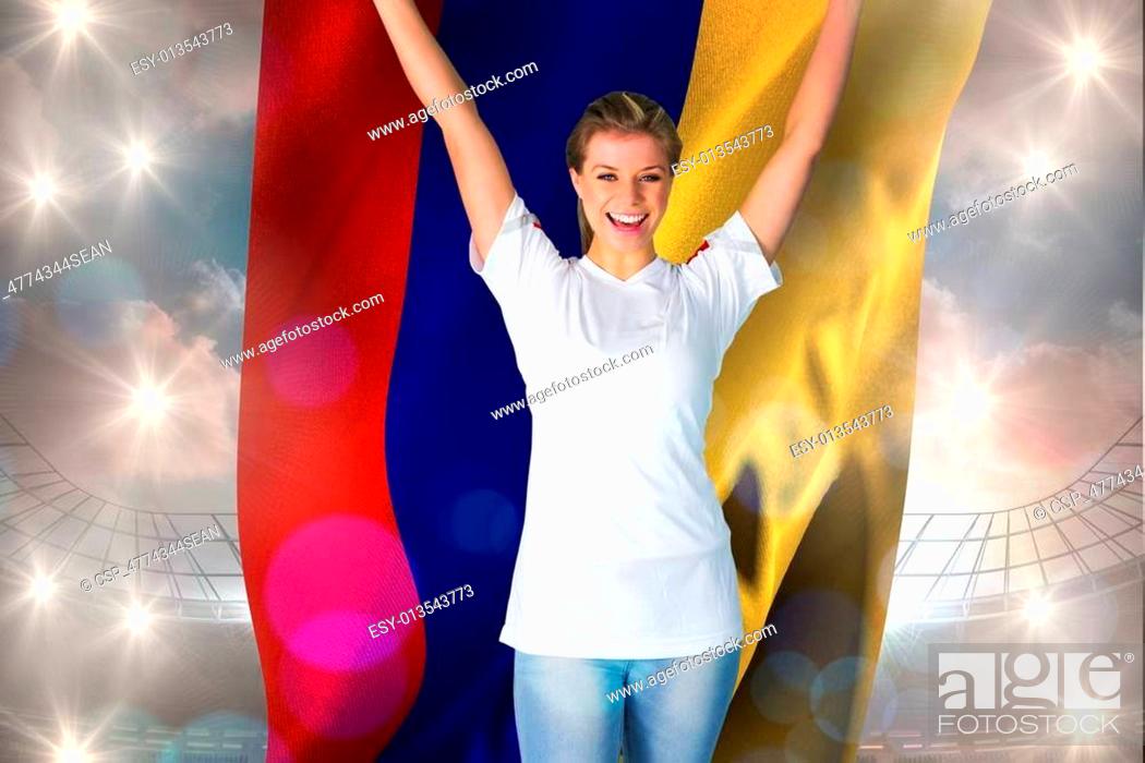 Stock Photo: Composite image of pretty football fan in white cheering holding.