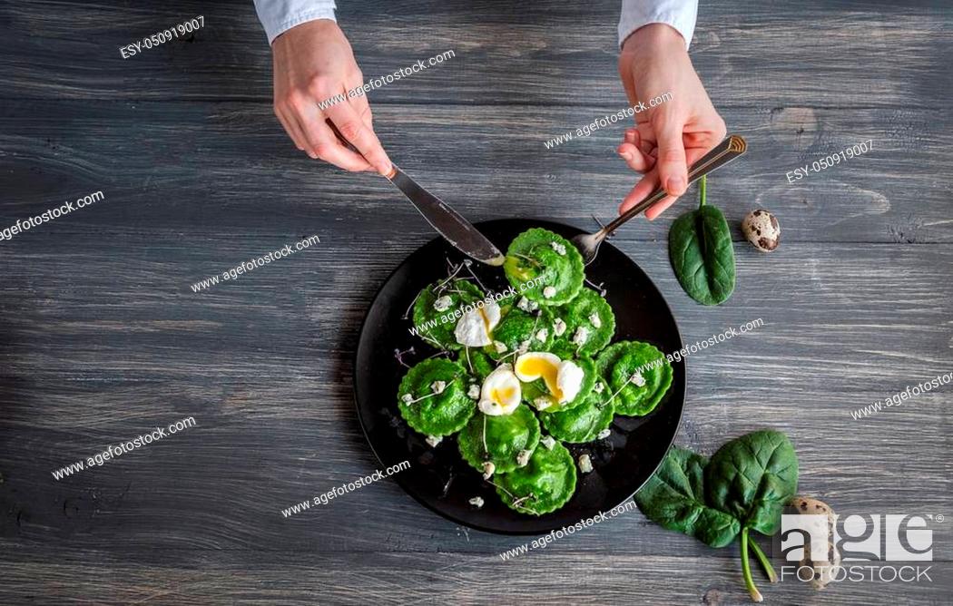 Stock Photo: delicious green ravioli with the addition of spinach dough, stuffed with ricotta and porcini mushrooms. poached quail egg, blue cheese.
