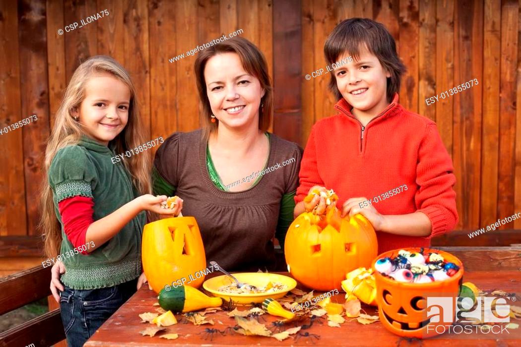 Stock Photo: Happy family preparing for Halloween.
