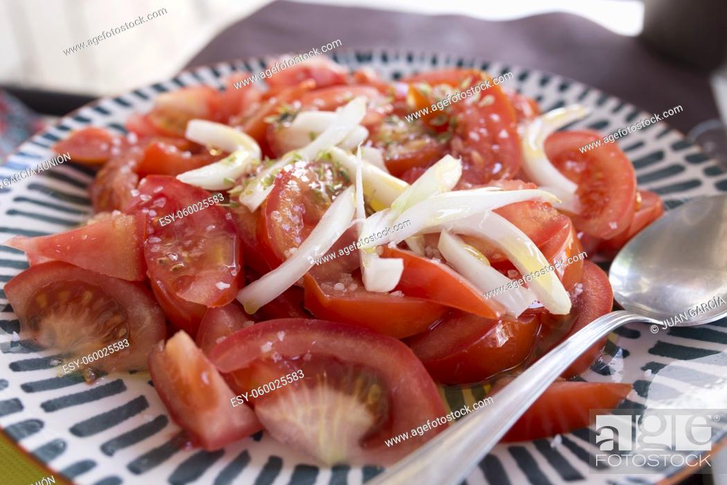 Stock Photo: Tomato simple salad with chopped onion, olive oil and oregano. Closeup.