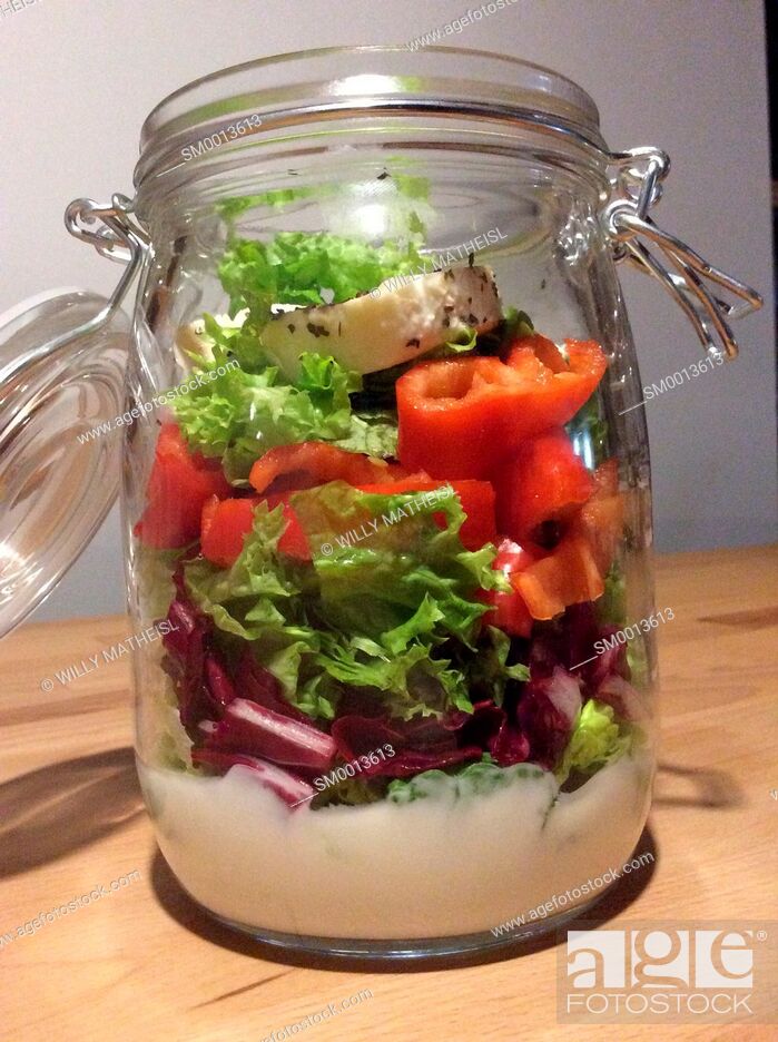 Stock Photo: Salad in a jar. A quick and portable healthy lunch in the go.