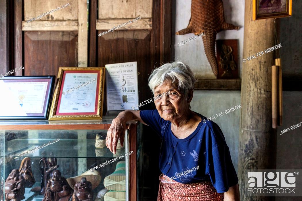 Stock Photo: Cambodia, Battambang, Wat Kor Village, Khor Sang House, older Cambodian woman, owner of traditional Khmer wood house built by her grandfather, no releases.
