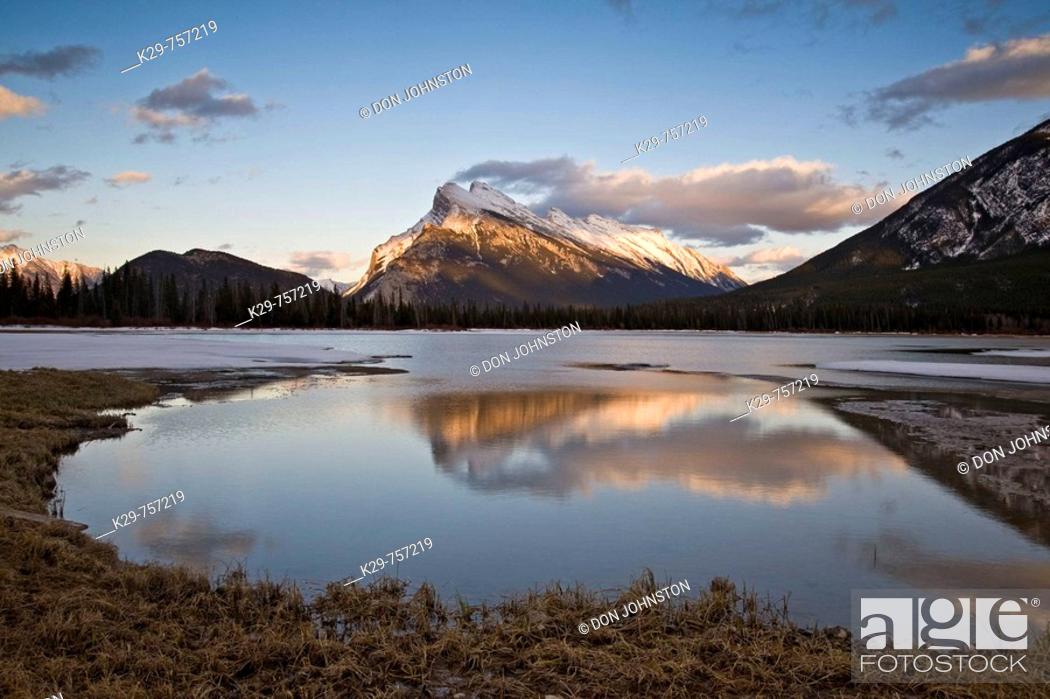 Stock Photo: Mt Rundle reflected in Vermilion Lake in early spring/late winter. Banff National Park, Alberta.