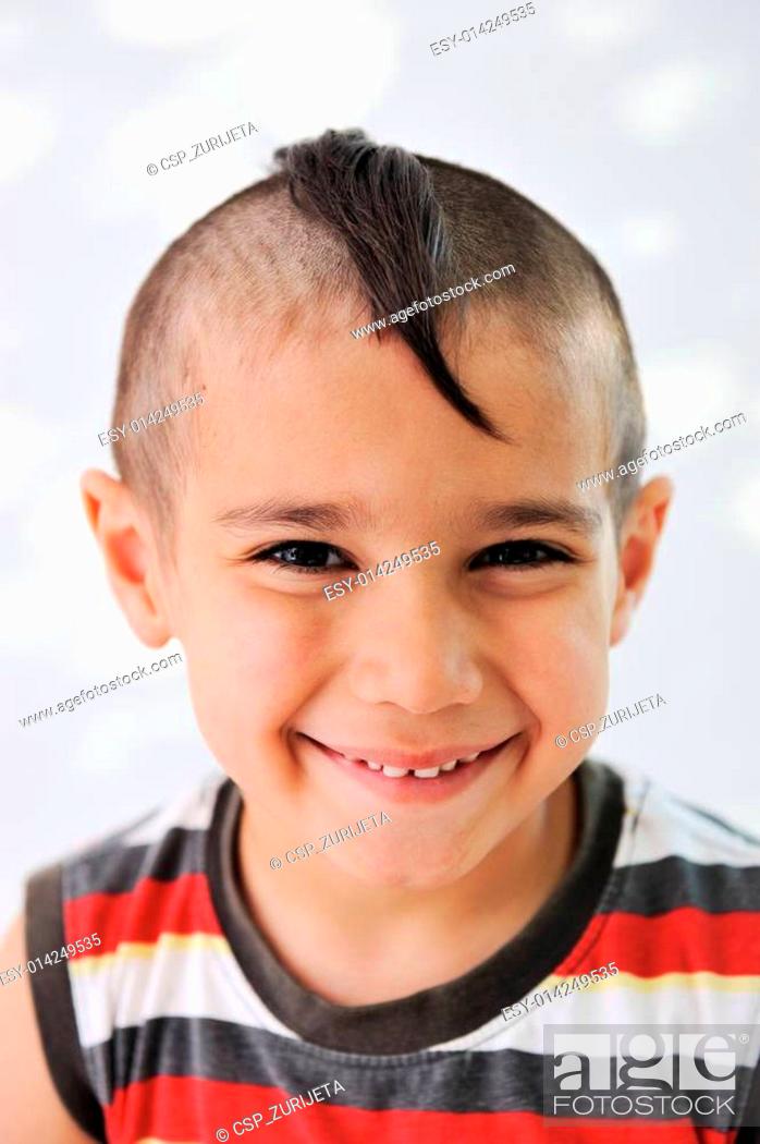Cute little boy with funny hair and grimace, Stock Photo, Picture And Low  Budget Royalty Free Image. Pic. ESY-014249535 | agefotostock
