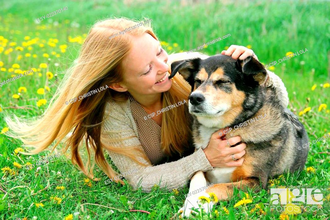 Stock Photo: Happy Girl Outside PLaying With German Shepherd Dog.