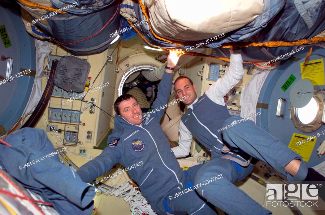 Stock Photo: Two Soyuz Taxi crewmembers, Flight Engineer Roberto Vittori (left) of the European Space Agency (ESA) and South African space flight participant Mark.