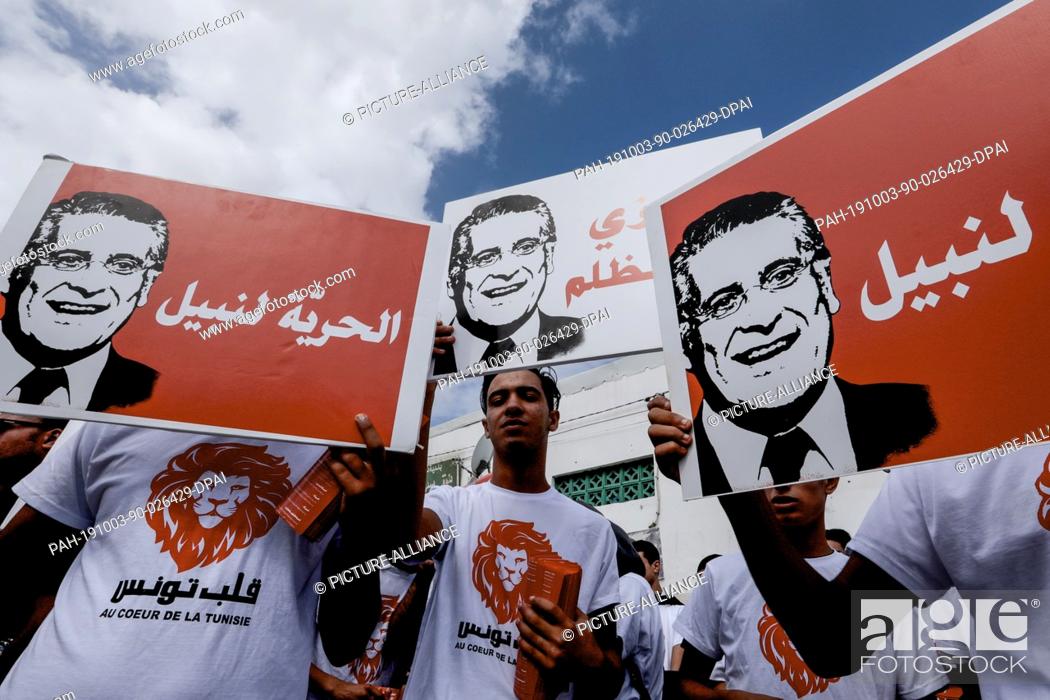 Stock Photo: 03 October 2019, Tunisia, Tunis: Supporters of the jailed Tunisian media magnate and presidential candidate Nabil Karoui.
