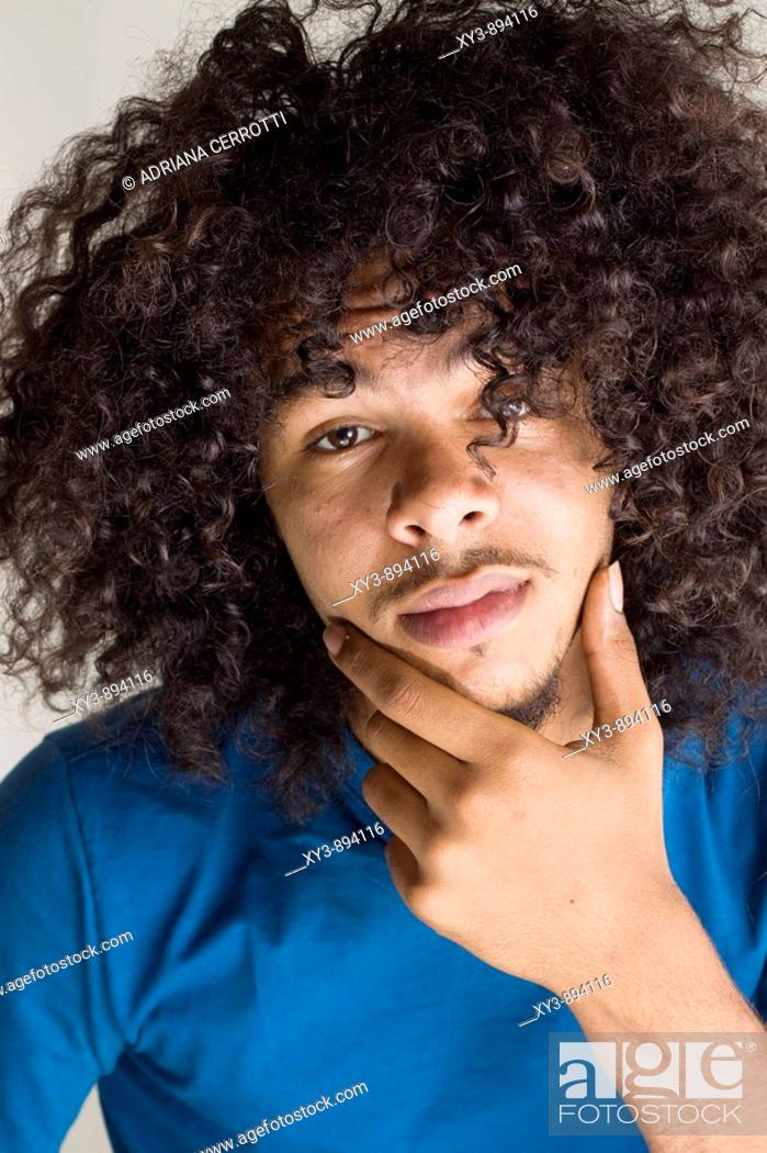 Portrait of a young African American man with big and long curly hair and  mustache with a gesture of..., Stock Photo, Picture And Rights Managed  Image. Pic. XY3-894116 | agefotostock