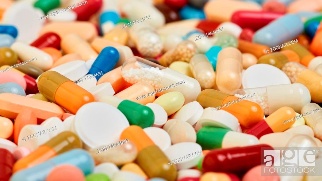 Stock Photo: Medizin Hintergrund mit vielen verschiedenen bunten Medikamenten.