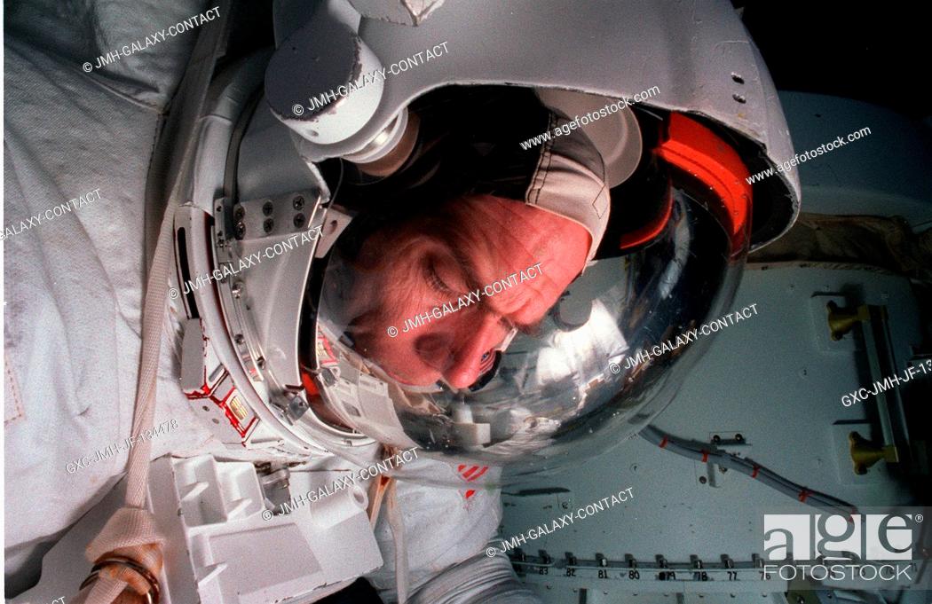 Stock Photo: Astronaut Daniel T. Barry, mission specialist, wears a training version of the extravehicular mobility unit (EMU) space suit during an underwater simulation of.